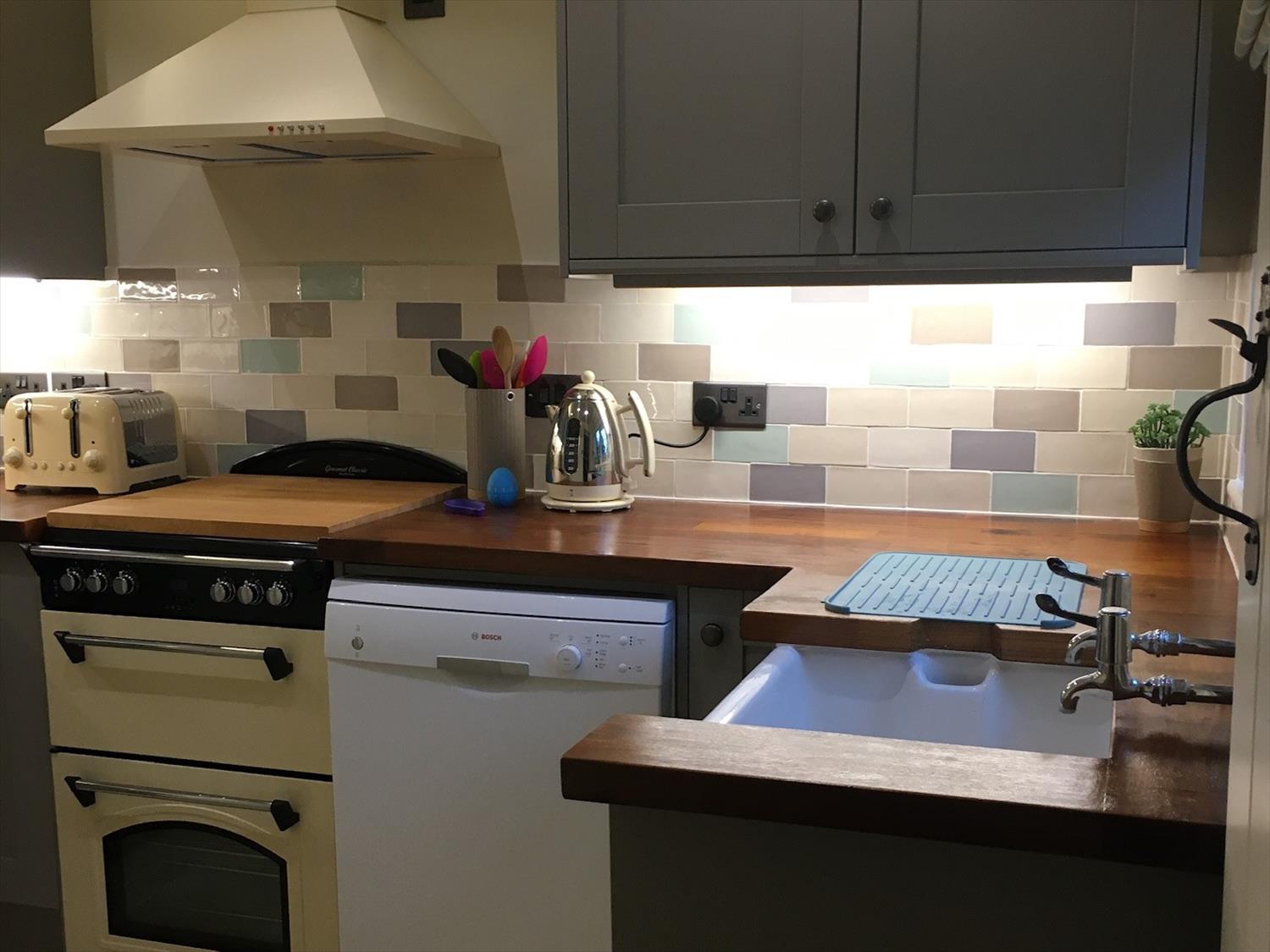 Dishwasher, electric oven and hob in kitchen in 9 Melinda Cottage East Runton @NorfolkCoastline